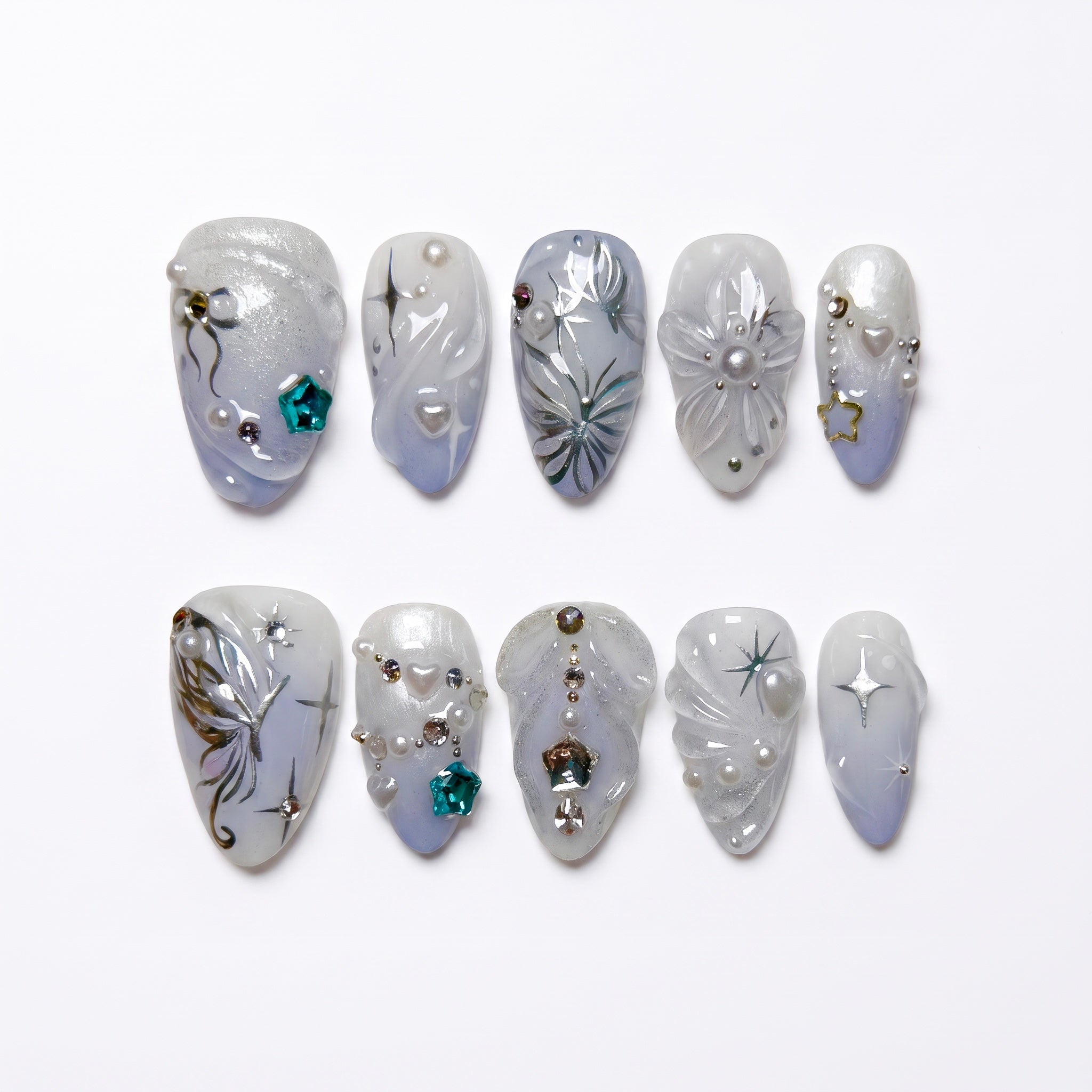 Moonlit Wings press-on nails with icy blue and pearly white gradient, silver butterflies, and star accents – dreamy Water · Flow design by Nailsium.