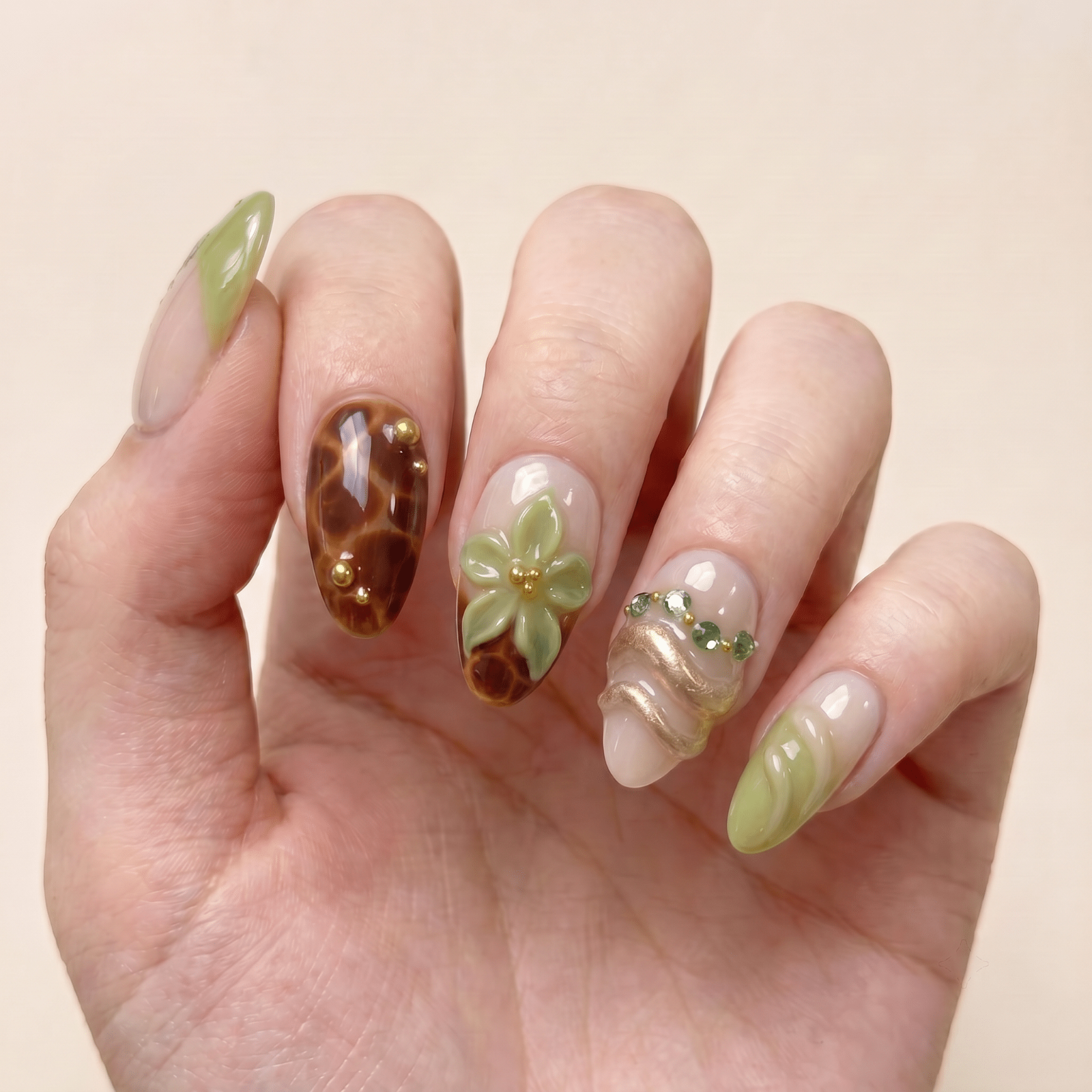 Olive green press-on nails worn on hands by Nailsium