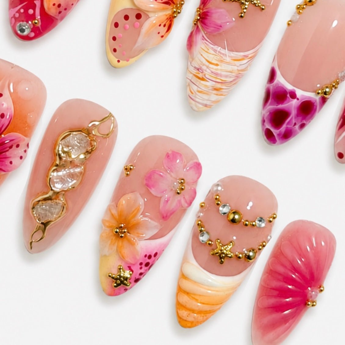 Pink tropical flower press-on nails with shell inspired accents by Nailsium