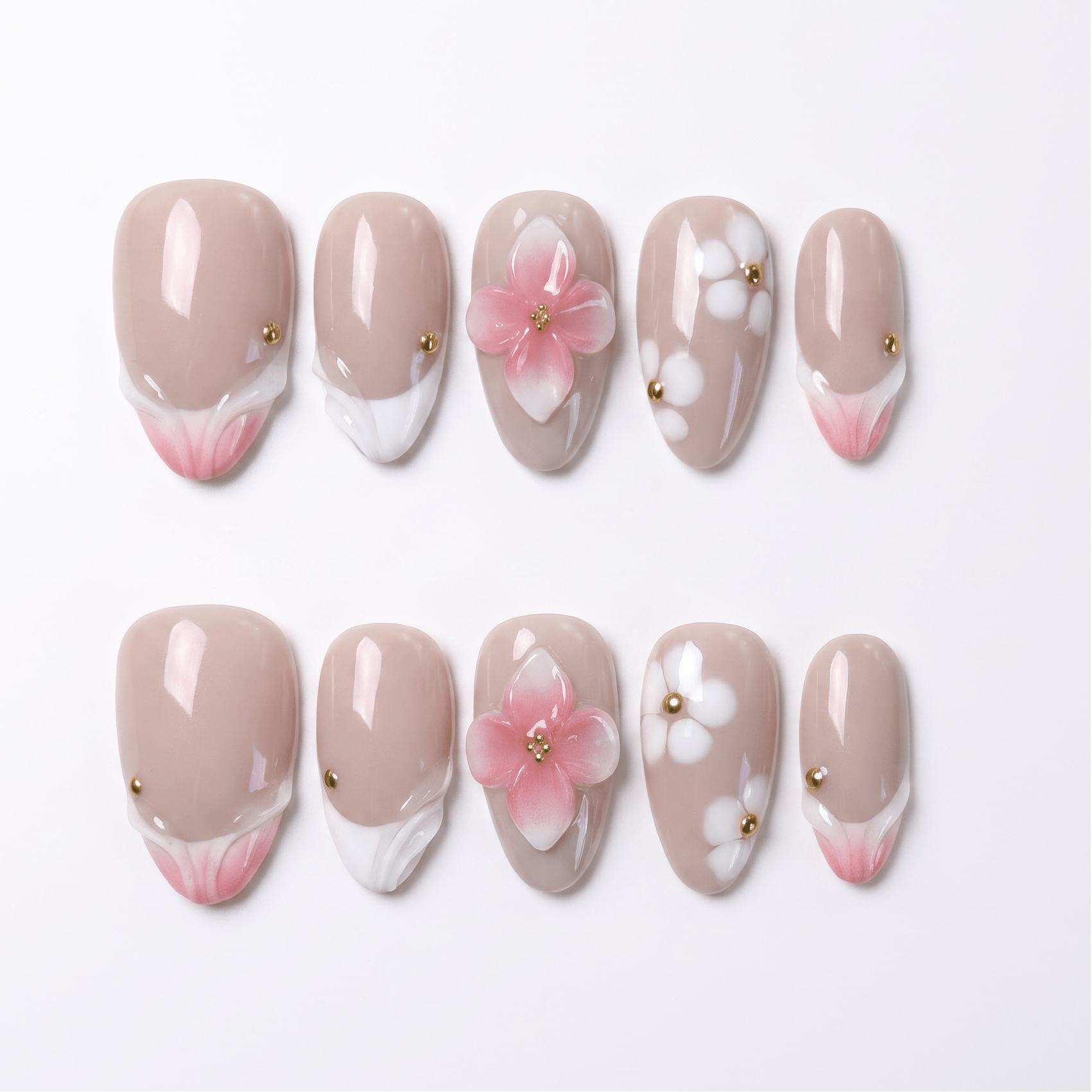 Handmade peach pink floral press-on nails with 3D flowers, soft French tips, and gold accents inspired by summer peach sorbet.