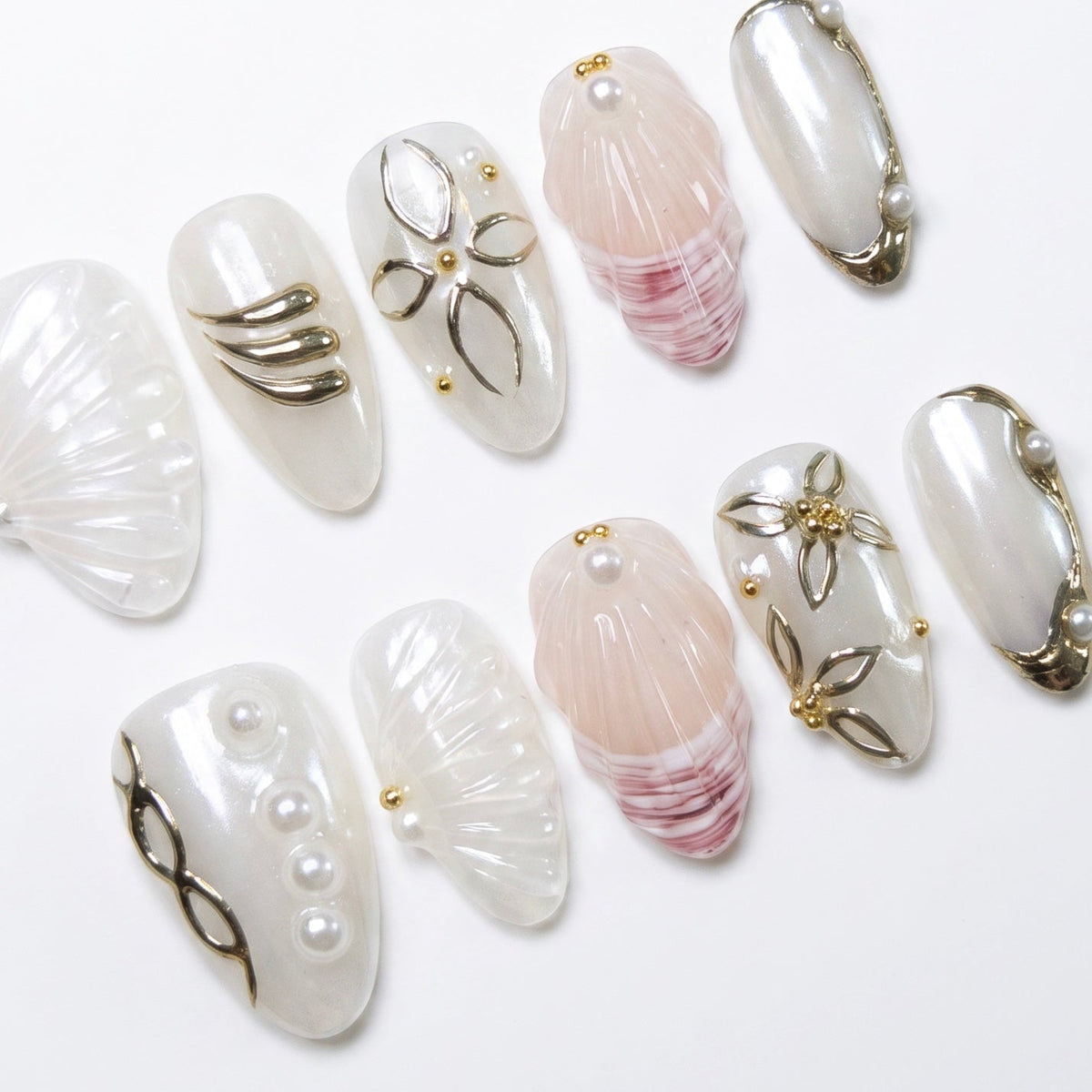 Seashell texture nail art with glossy pearl finish