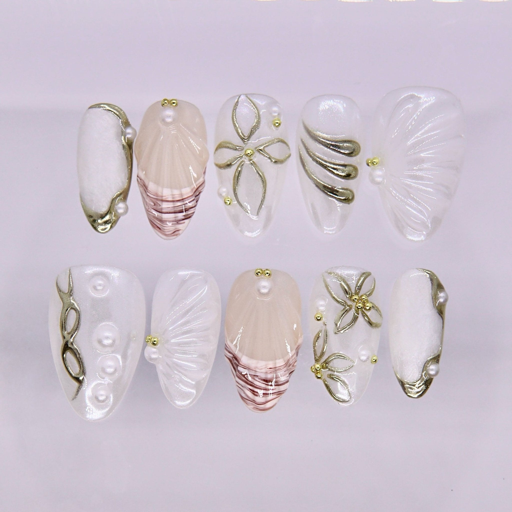 Pearl shell inspired press on nails with soft gold accents
