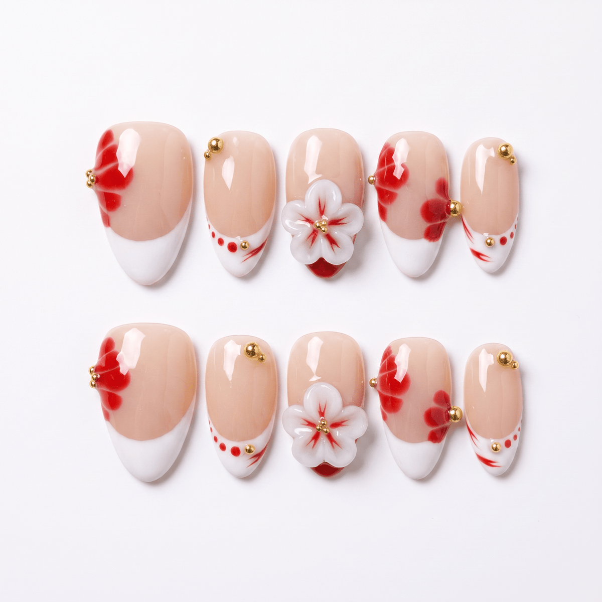 Petal Trace press-on nails with red petal designs and hand-sculpted floral accents
