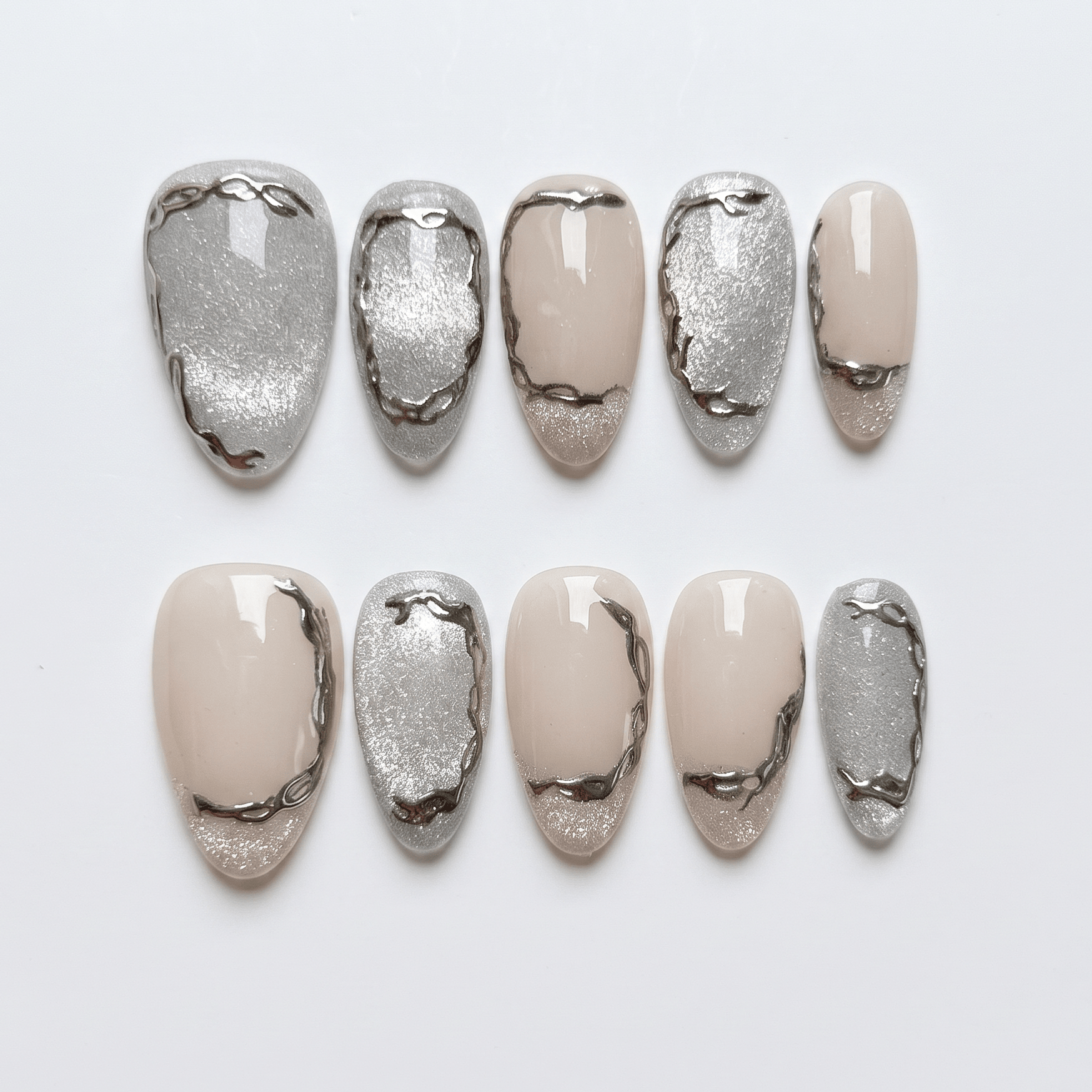Close-up of neutral nails with fluid metallic detailing and glossy finish