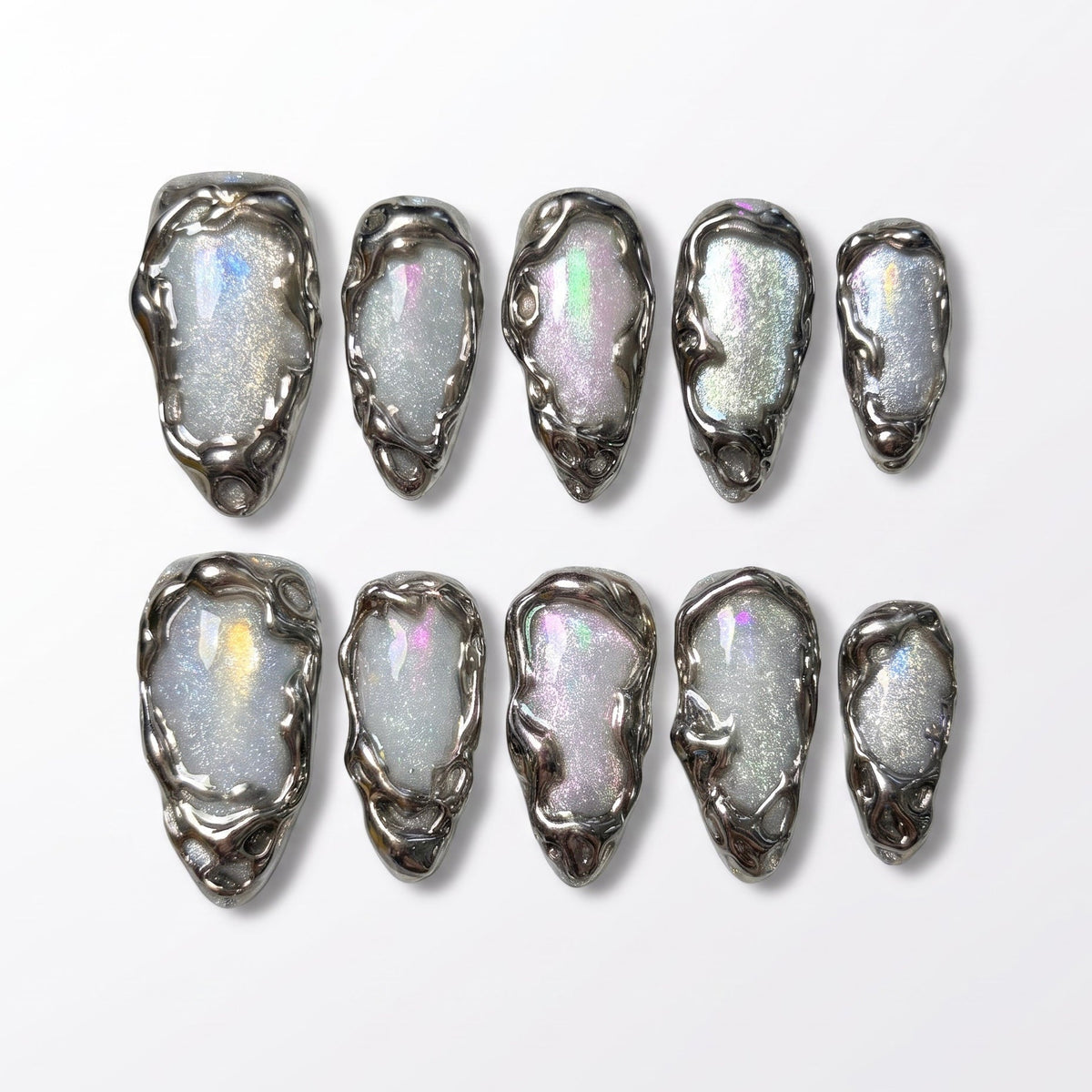 Handmade pearl chrome press-on nails with sculptural liquid silver details inspired by shimmering summer pool reflections.
