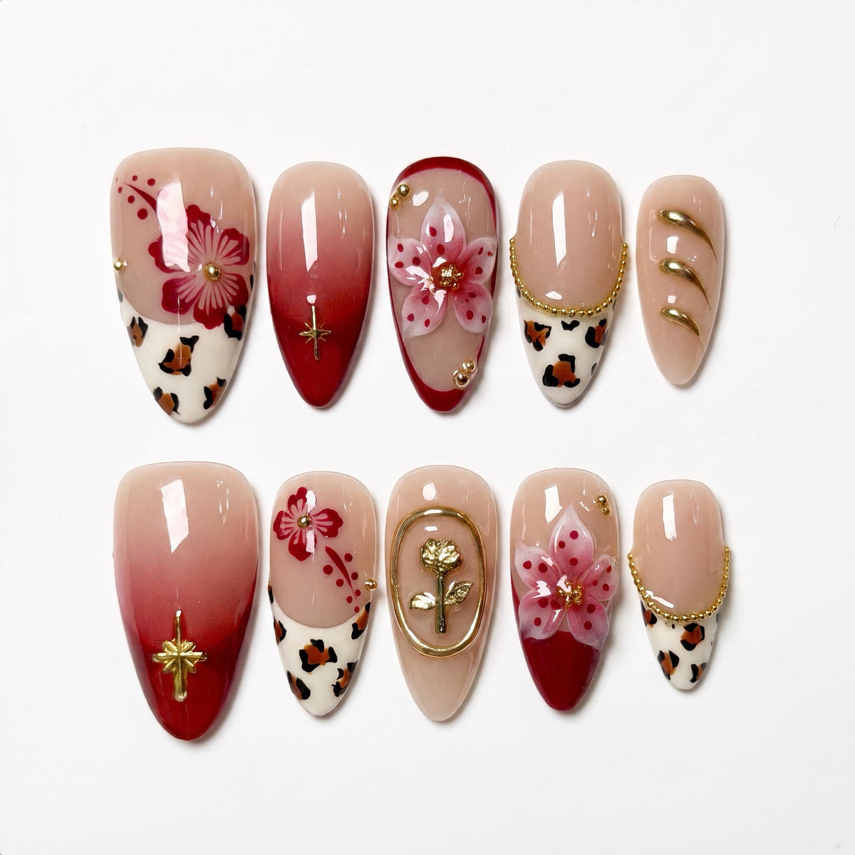 Red gradient press on nails with floral design, leopard print accents, and gold details