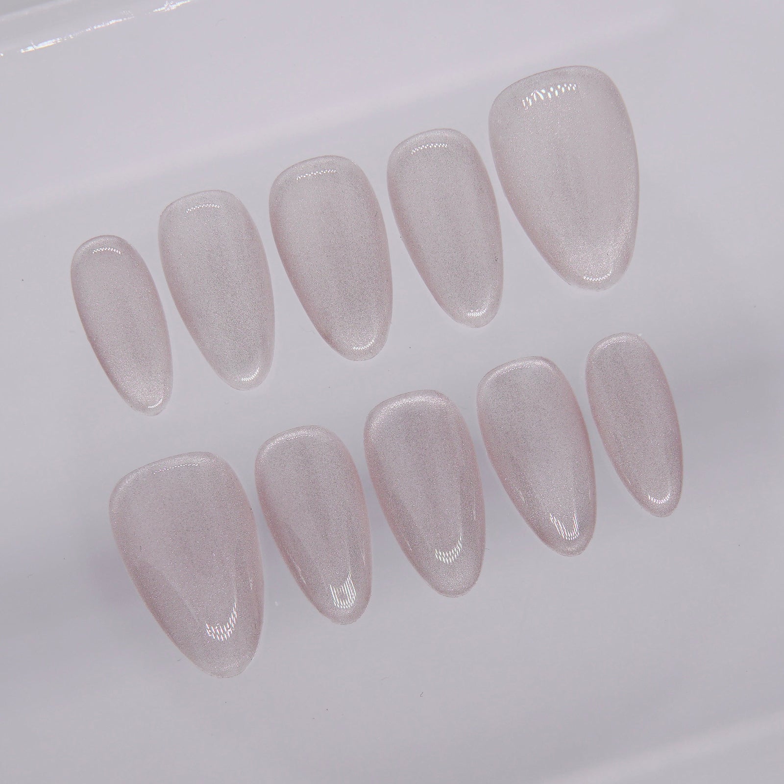 Macro detail showing metallic shimmer texture and cat-eye finish of Silver Focus nails.

