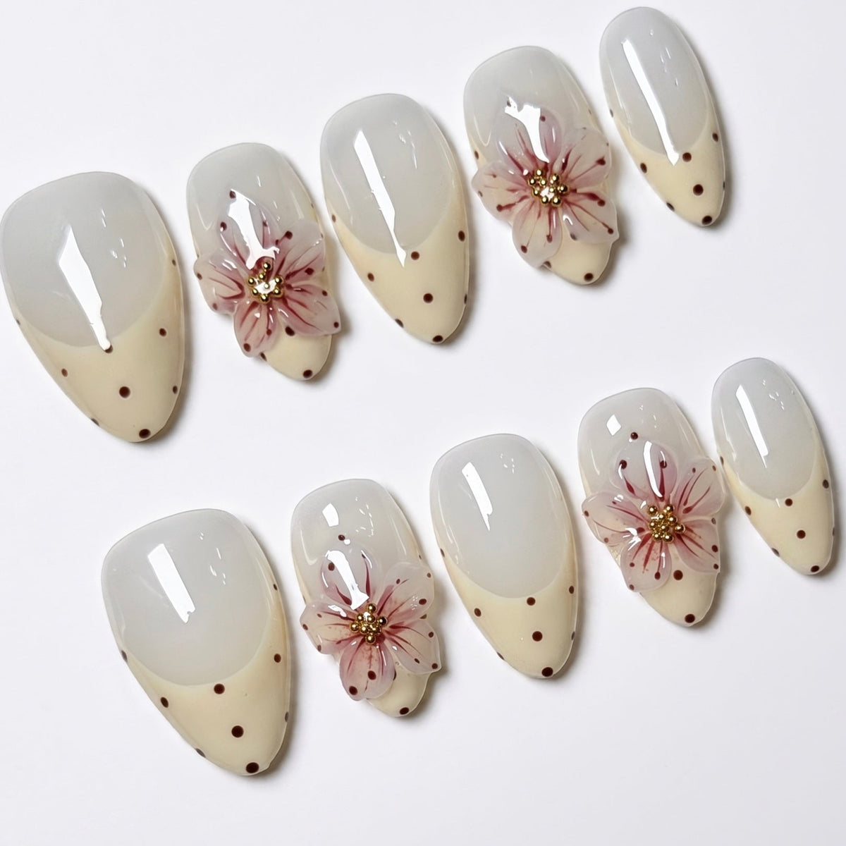 Minimal handmade floral almond nails with glossy finish