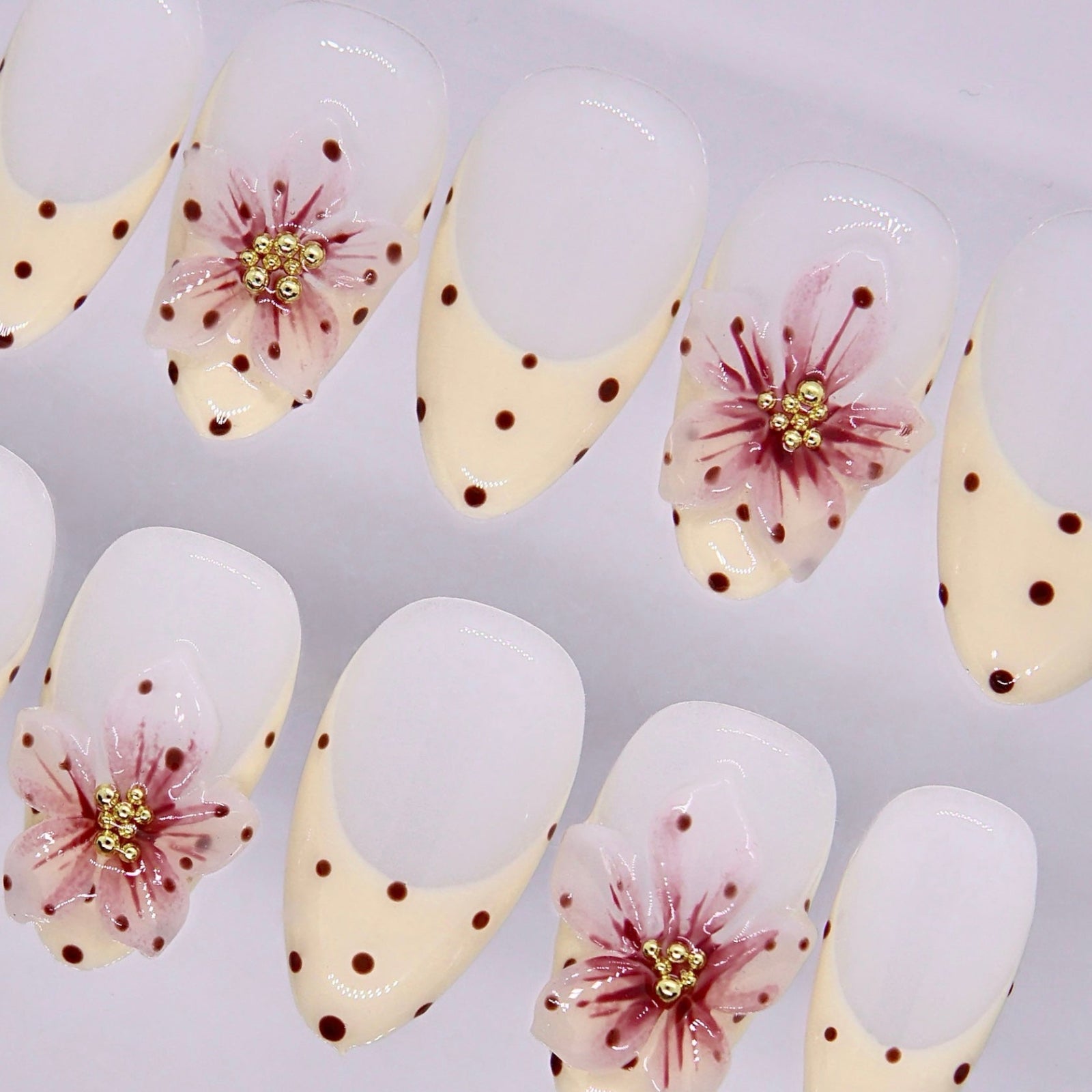 Minimal handmade floral almond nails with glossy finish