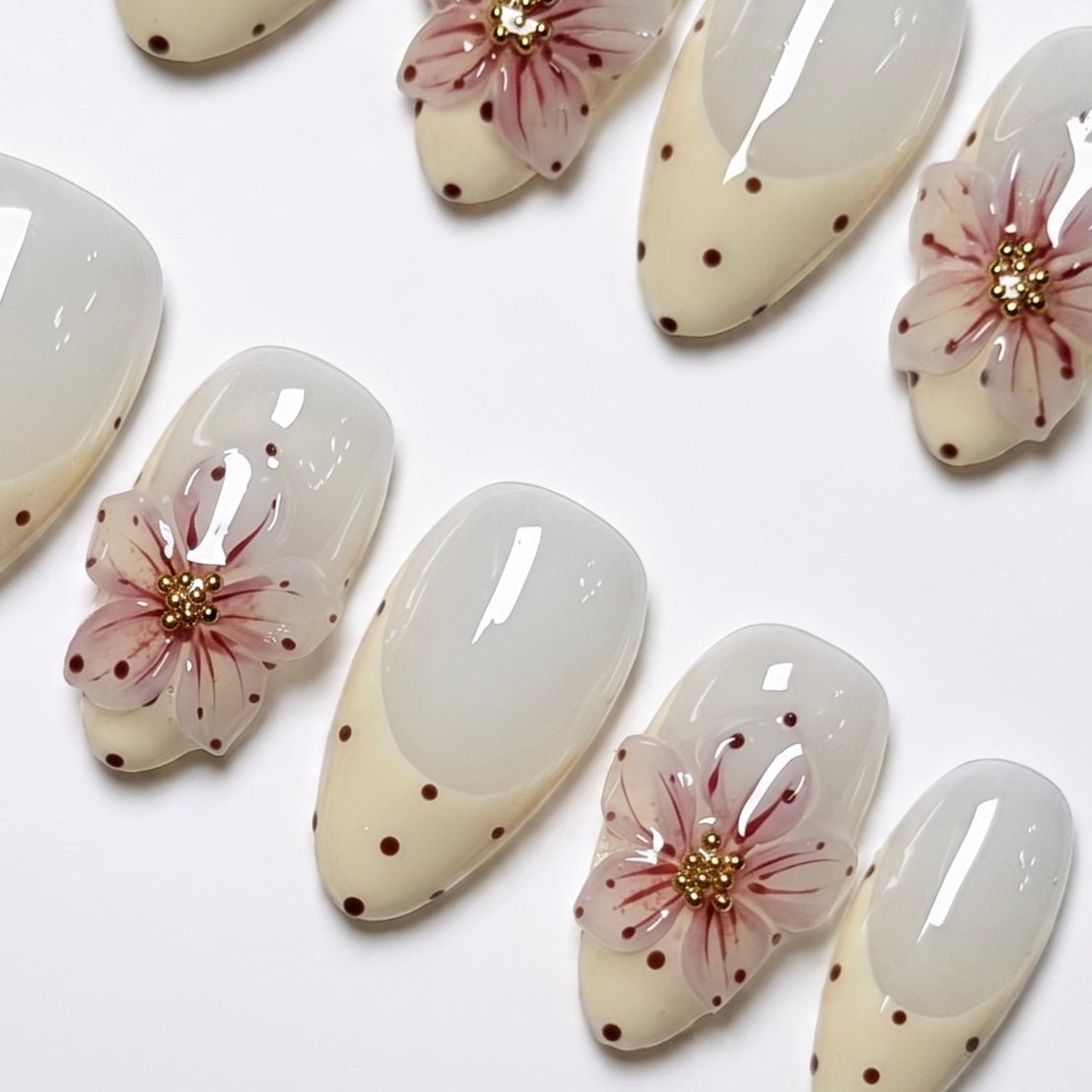 Minimal handmade floral almond nails with glossy finish