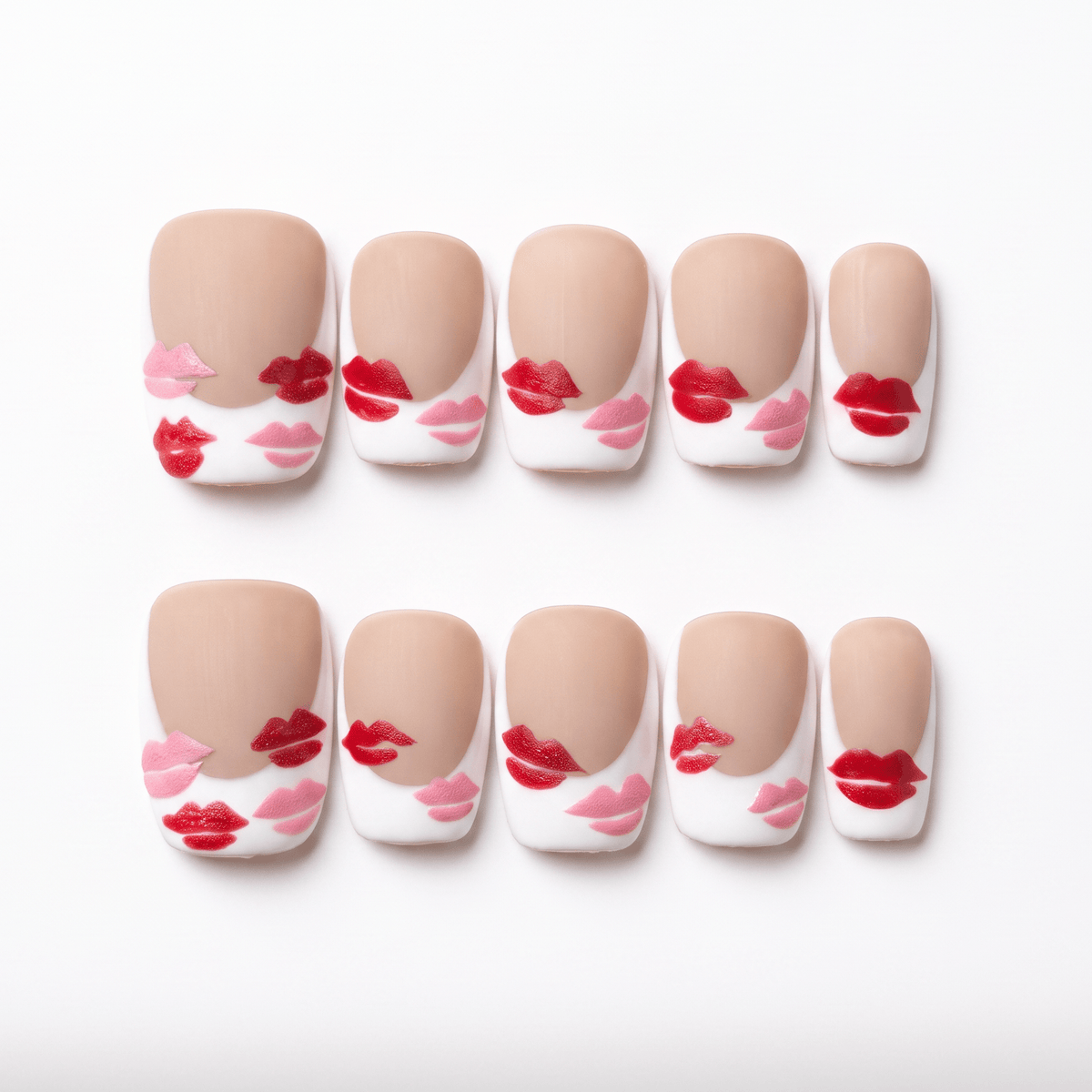 Monkey zodiac press-on nails in nude matte tones with red and pink lip designs, symbolizing sparkle and joyful self expression.
