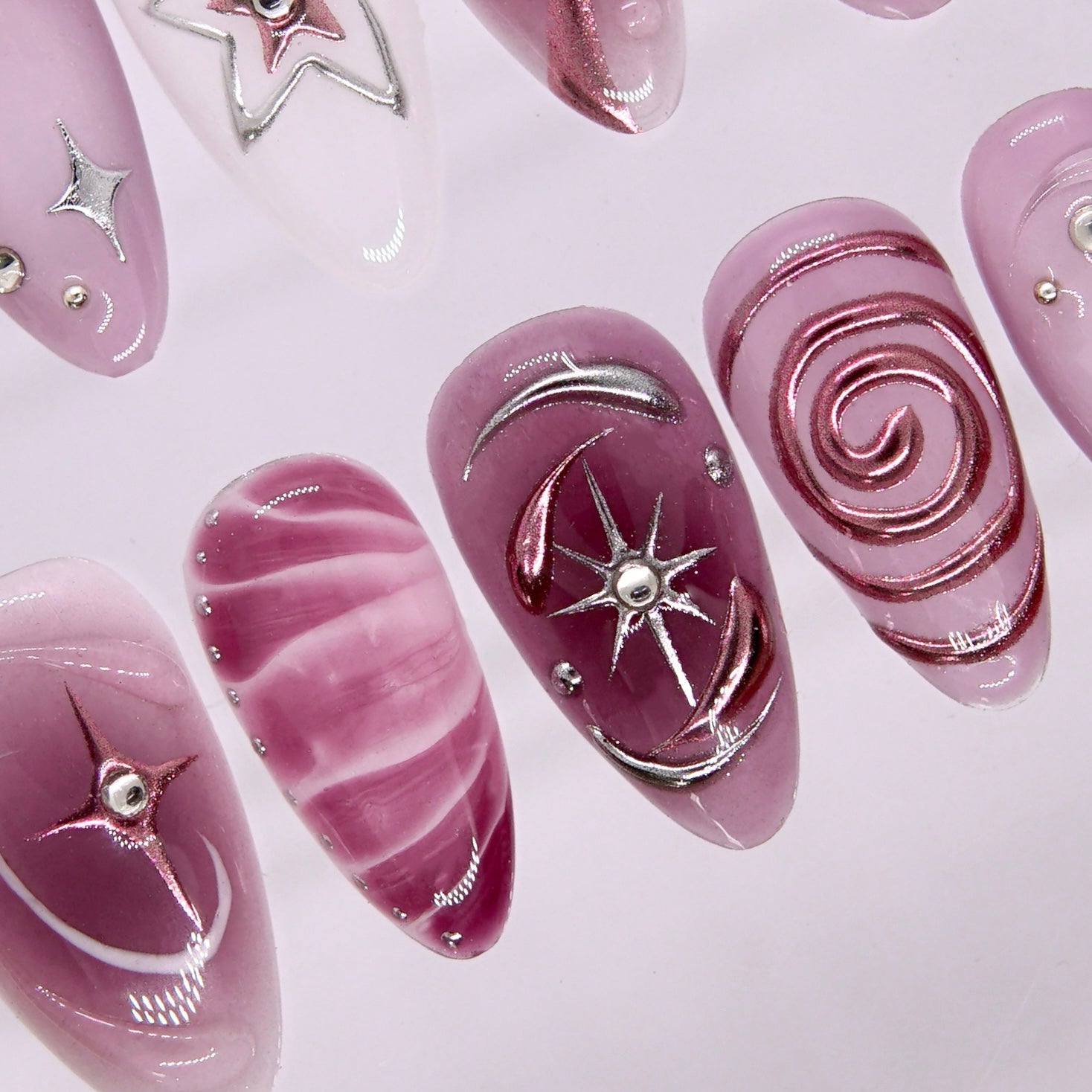 Side view highlighting mauve gradient and reflective cat-eye shimmer.