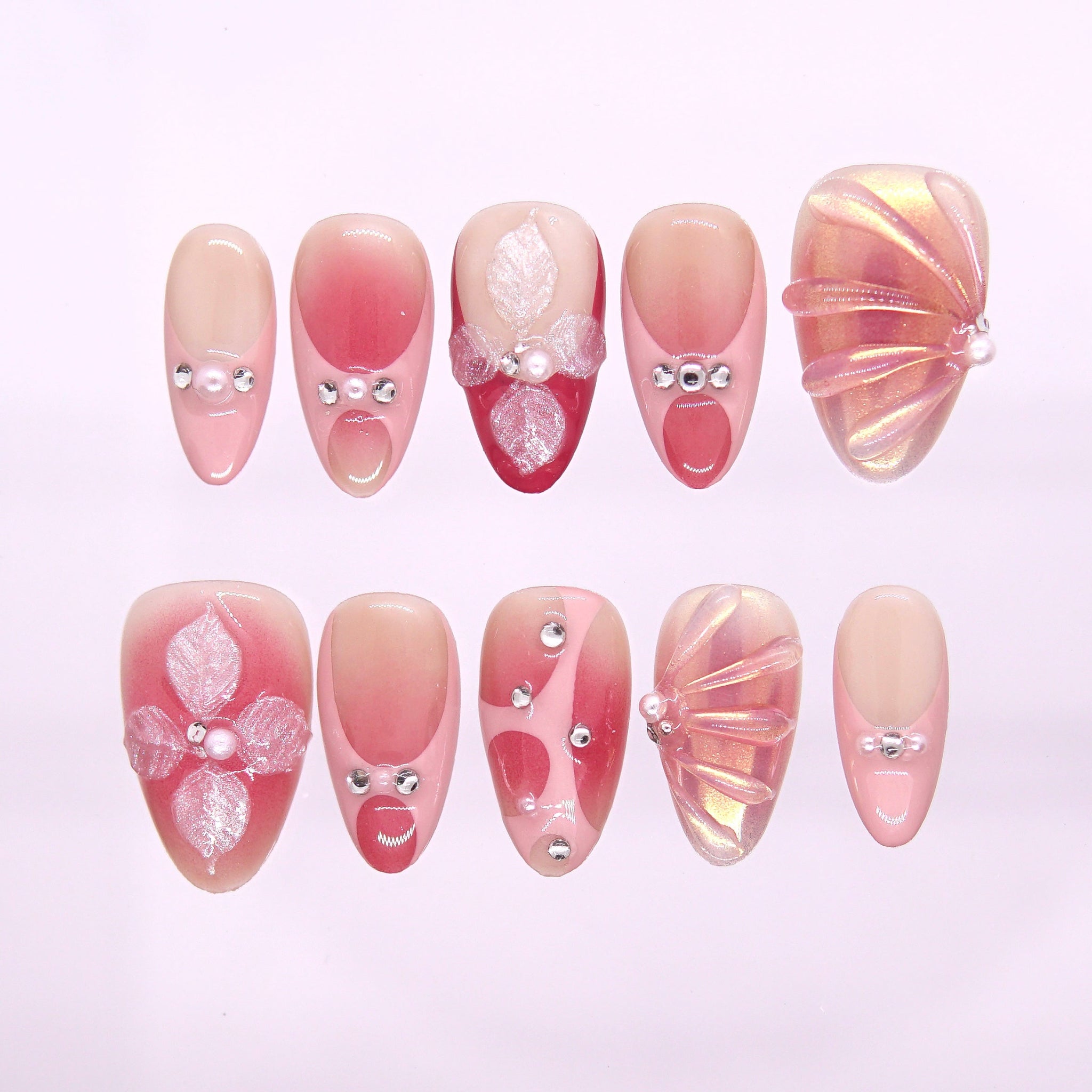 Sunset Veil press-on nails with peach-pink gradient, pearly petals, and soft sunset shimmer – elegant Earth · Calm design by Nailsium.