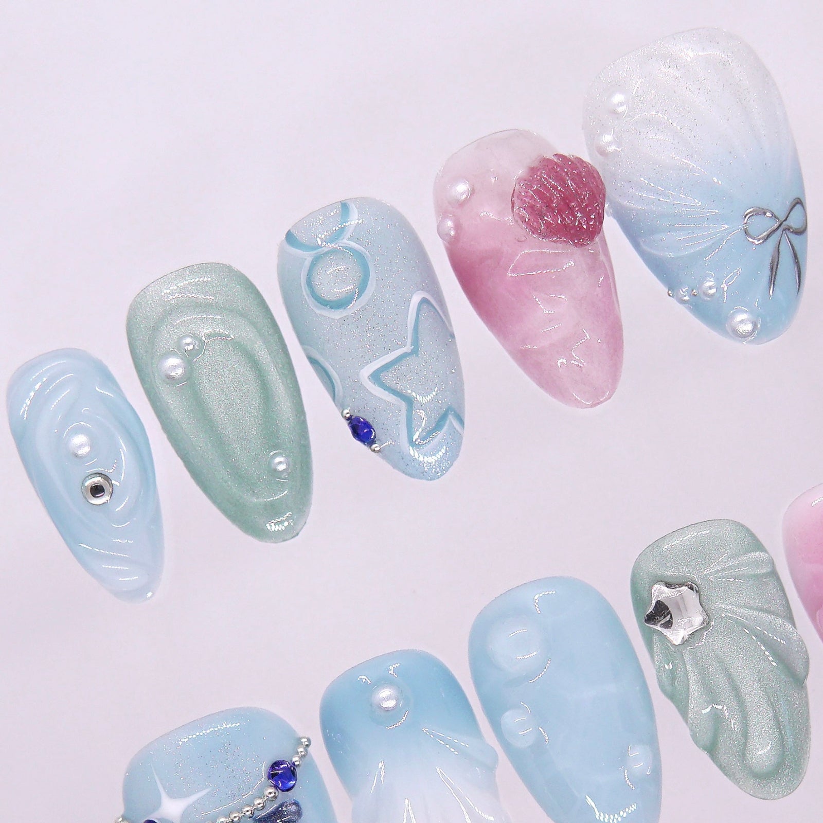 Macro shot of clear water droplet detail and shimmer glaze, showcasing the texture and reflective flow of the design.