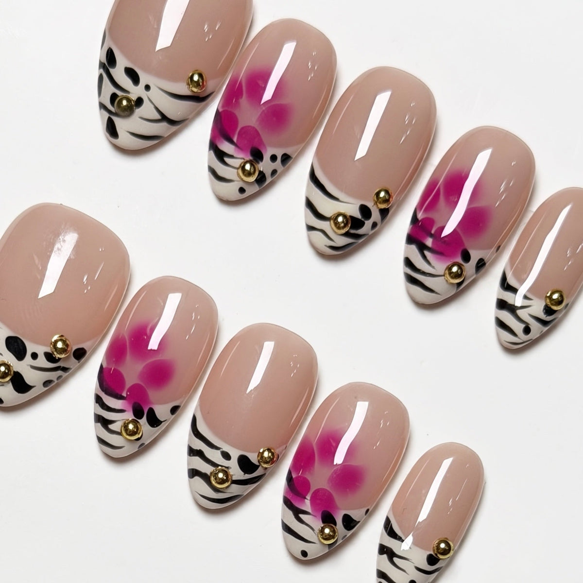 Soft pink floral airbrush design on almond press on nails