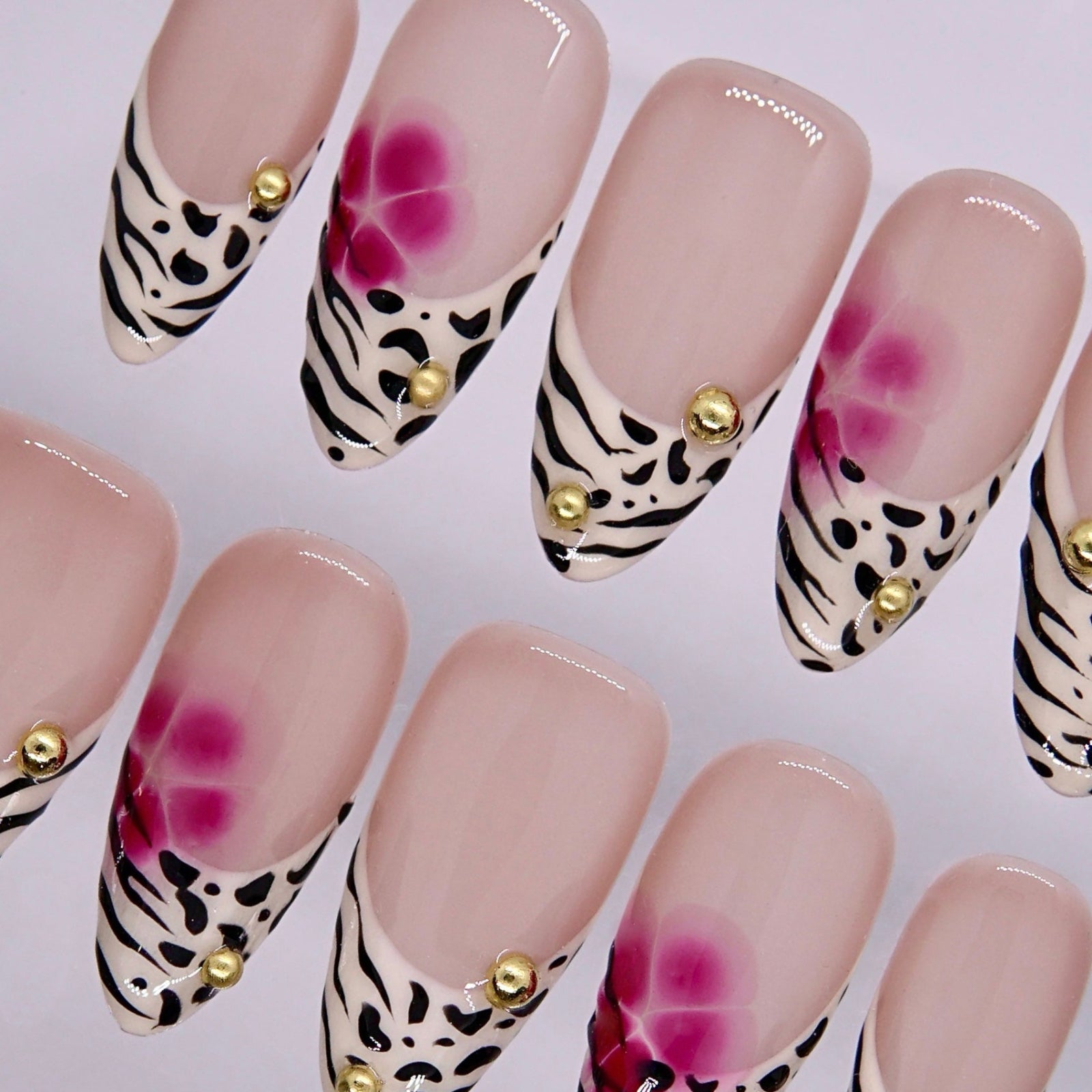 Soft pink floral airbrush design on almond press on nails