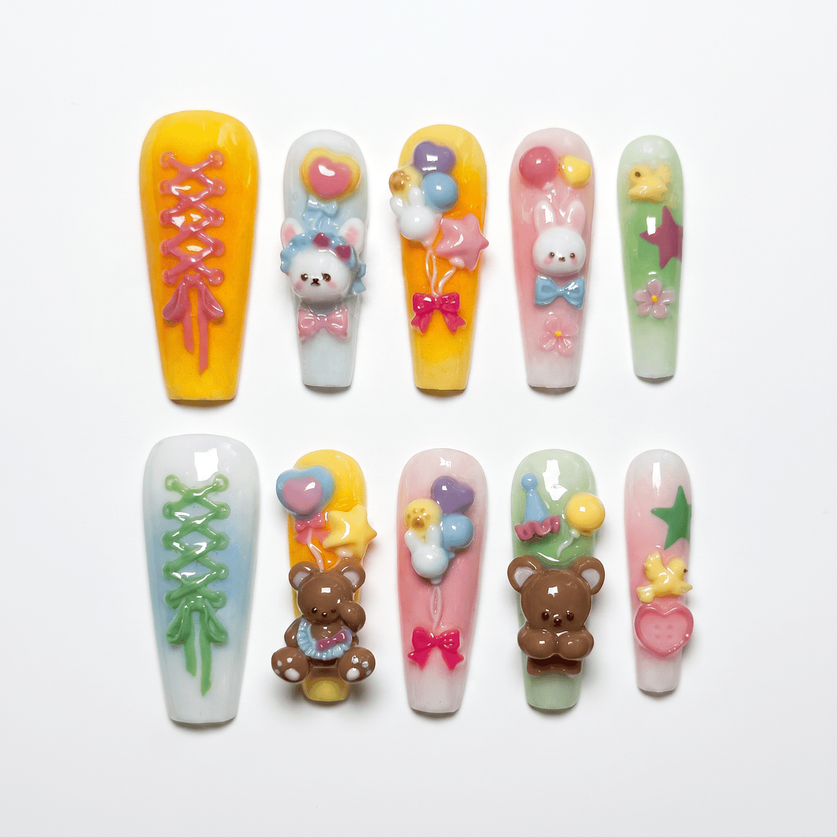 Toy Parade press-on nails with 3D bunnies, bears, balloons, and candy pastel stars – playful Wood · Bloom design by Nailsium.