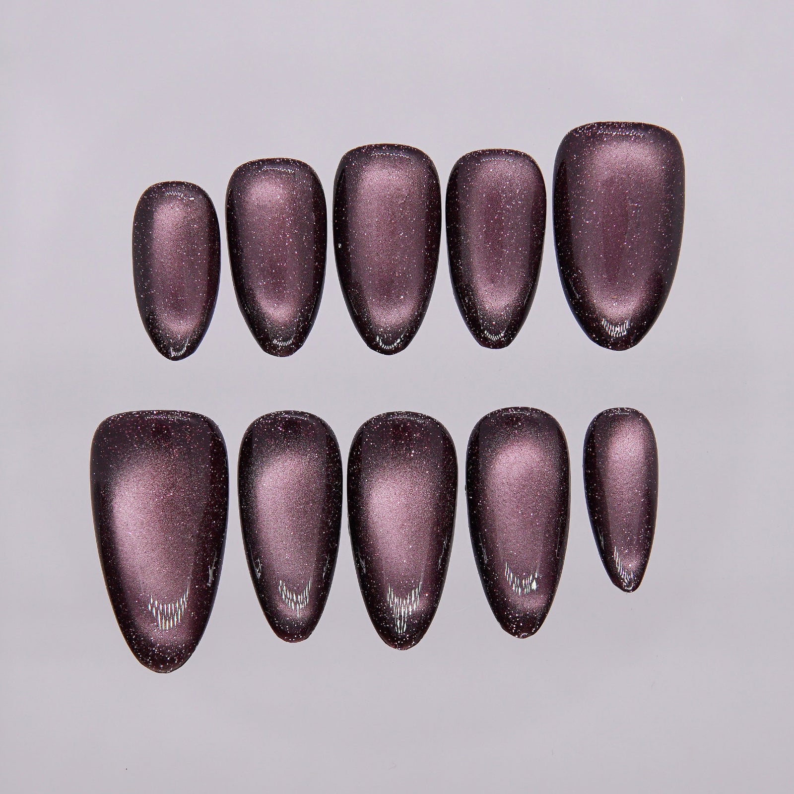 Reflective shimmer showing ember-like depth.