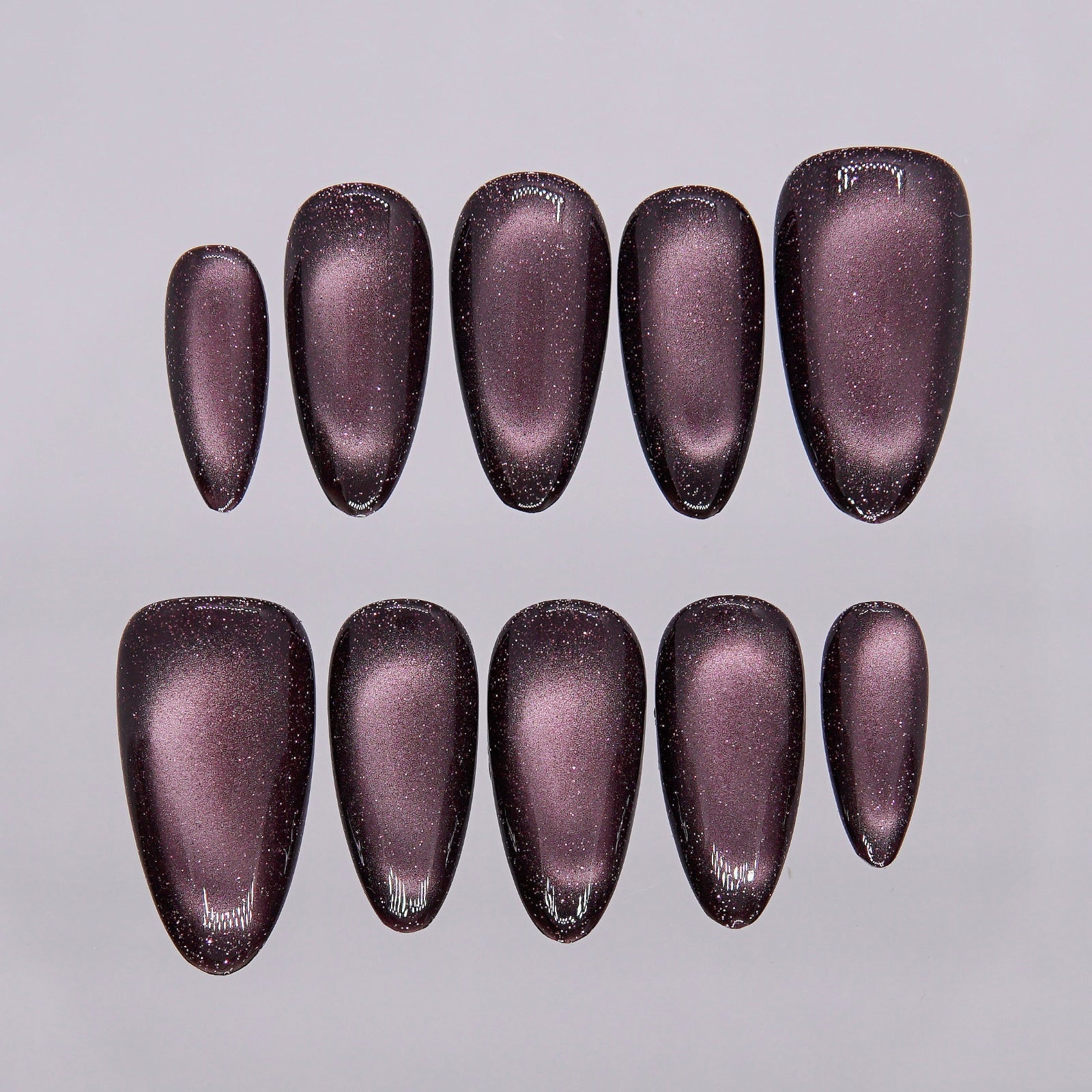 Close-up of glowing red-purple cat eye detail.