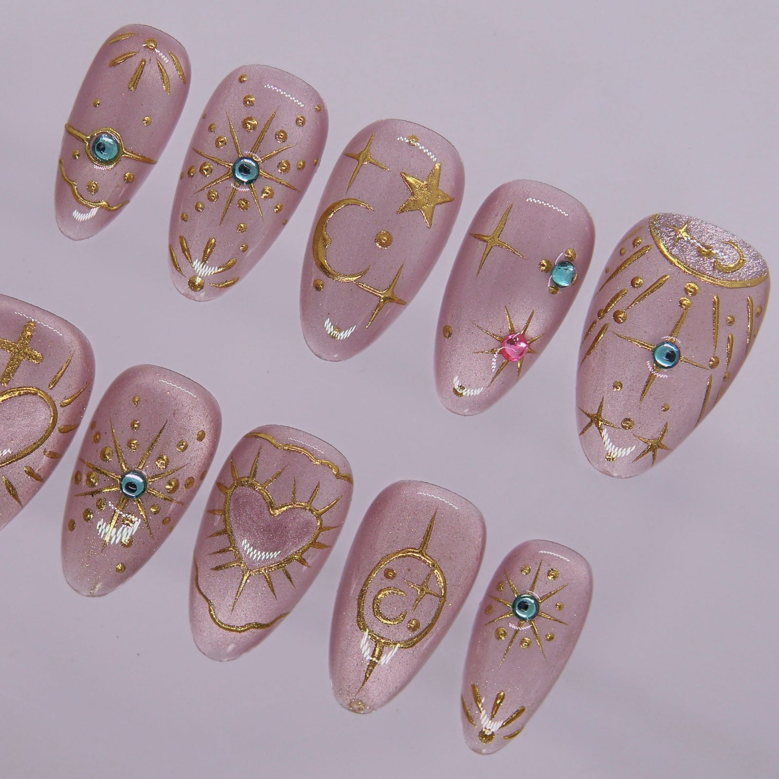 Detailed view of gem accents and shimmer lilac base on dreamy press-on nails.