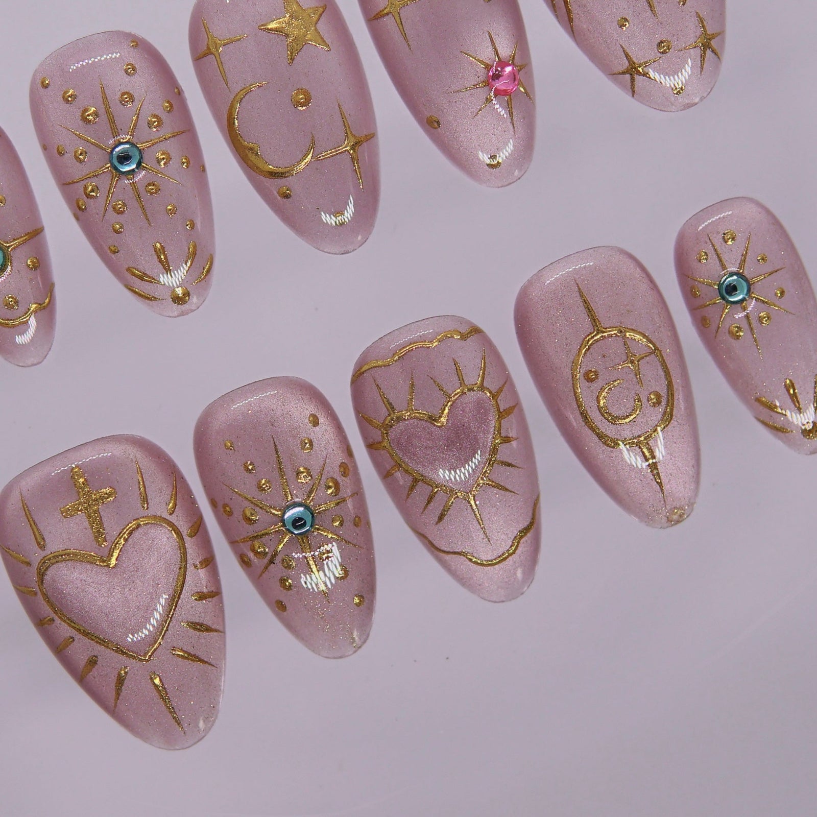 Detailed view of gem accents and shimmer lilac base on dreamy press-on nails.