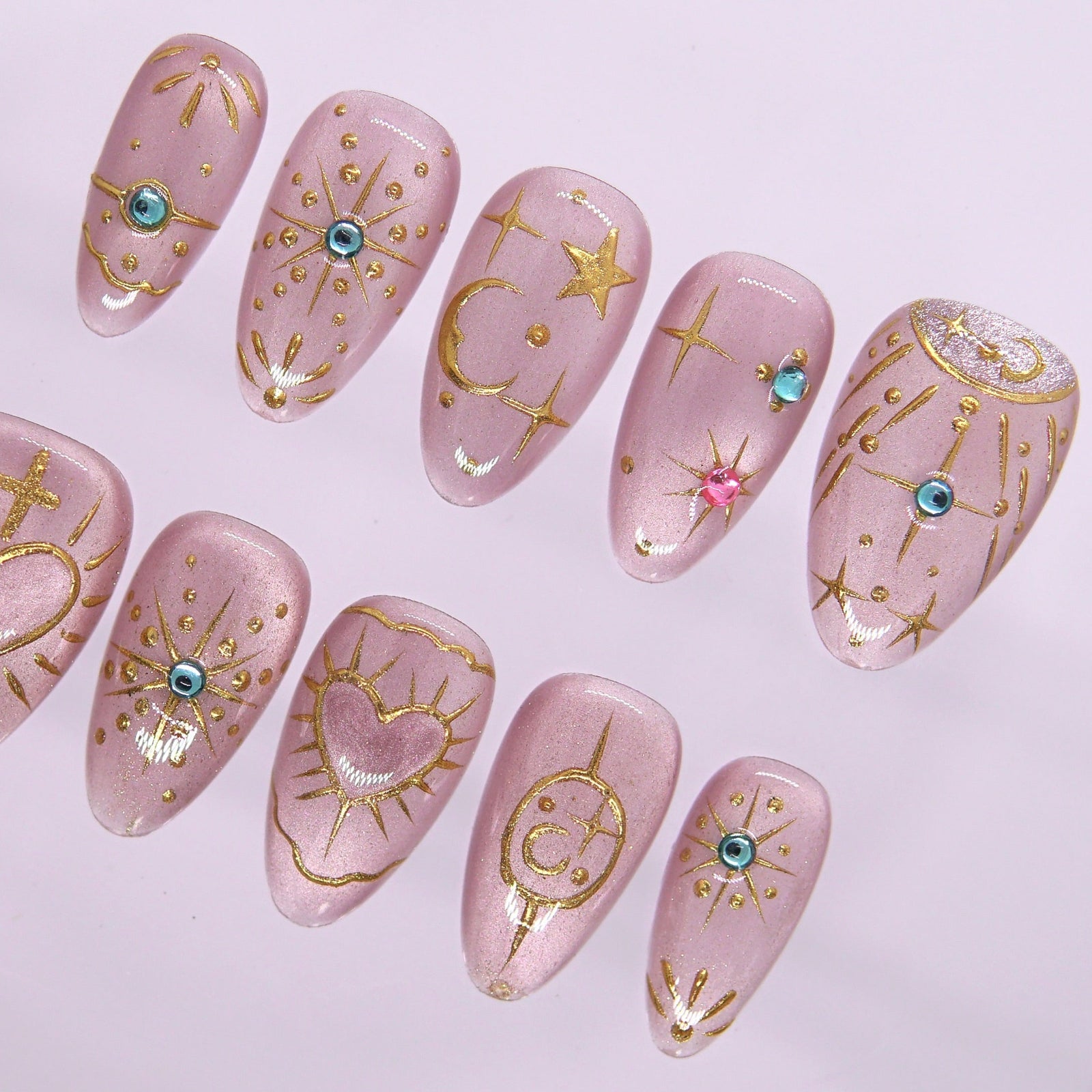 Detailed view of gem accents and shimmer lilac base on dreamy press-on nails.