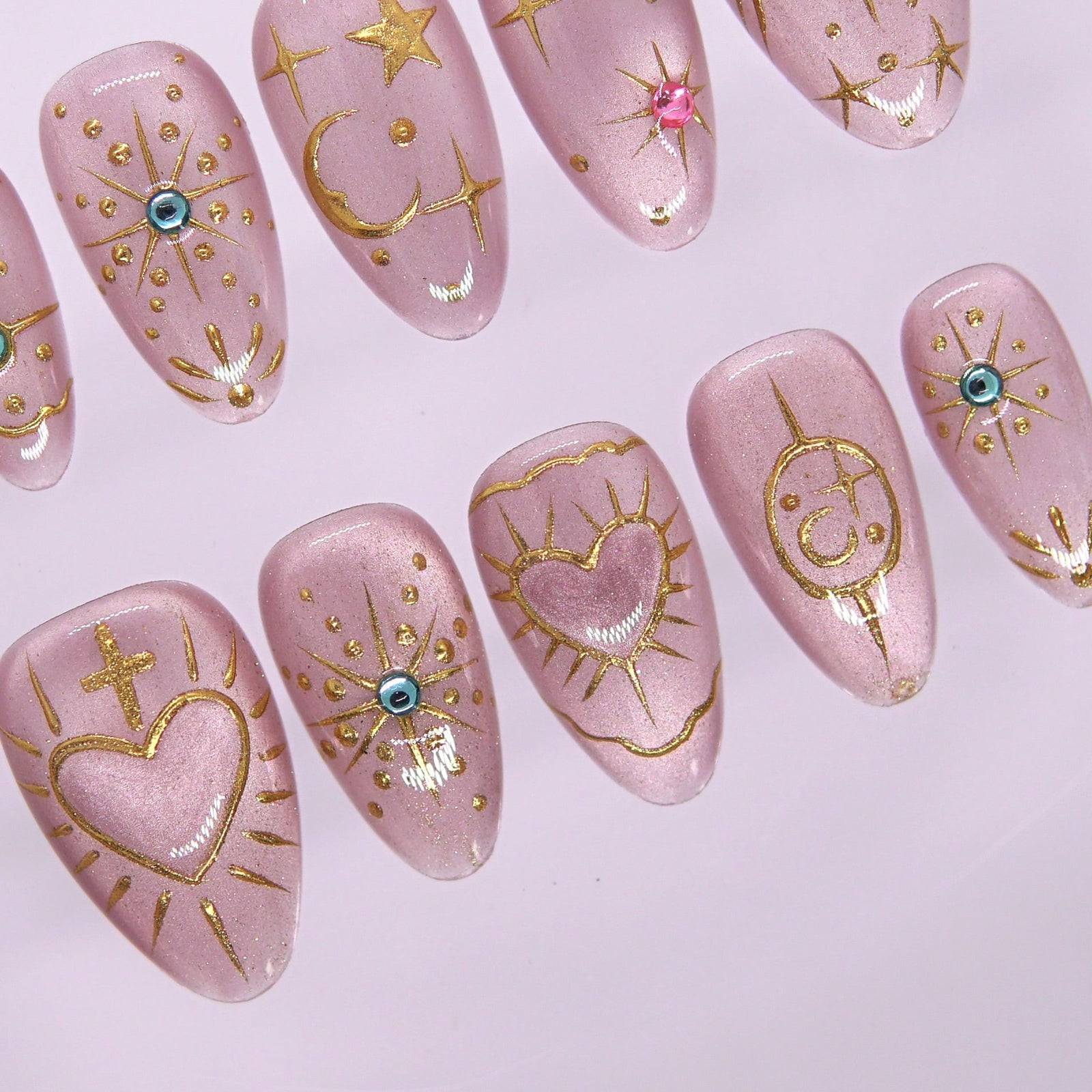 Detailed view of gem accents and shimmer lilac base on dreamy press-on nails.